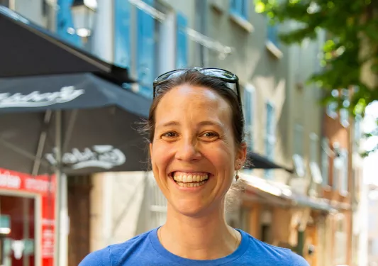 Backroads leader holding plate of croissants. 