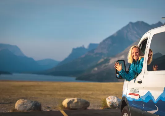 Backroads leader waving from van