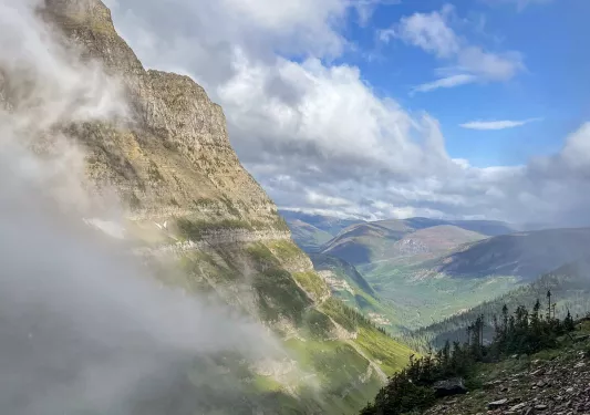 Foggy mountains and green valley