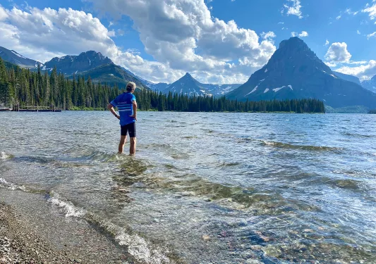 Backroads guest enjoying the cool blue water after bike ride