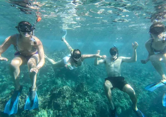 Teenagers snorkeling in Hawaii