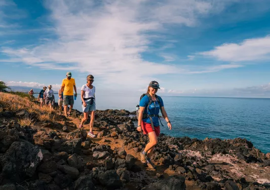 Hiking along the rocky coast in Hawaii