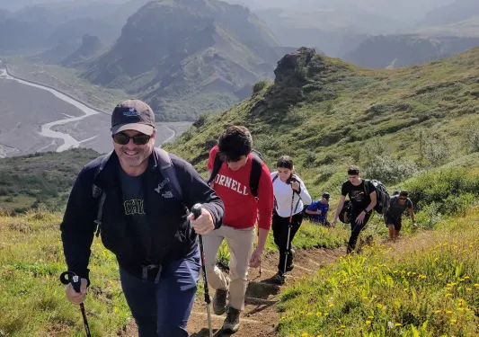 Guests ascending mountain trail