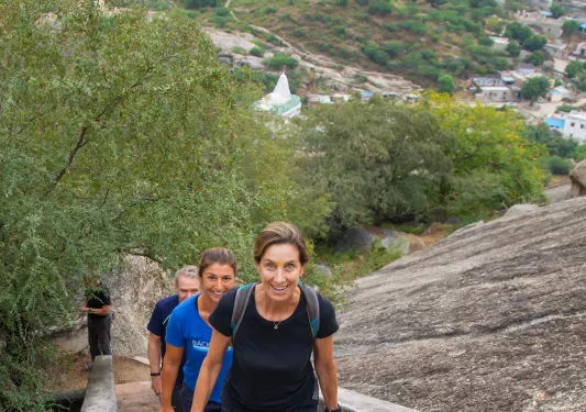 Climbing up a tall set of stairs in India