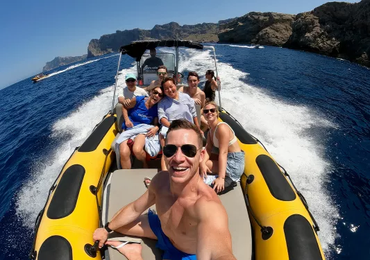 Selfie of guests on large, moving dinghy.