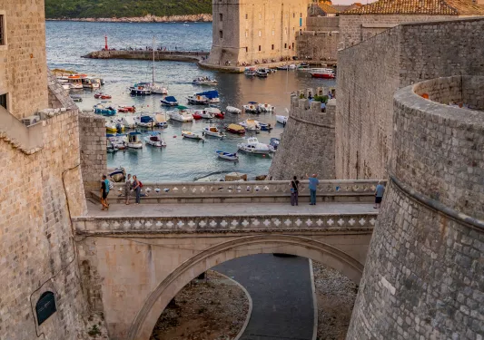 Walled outskirts of Dubrovnik during sunset.