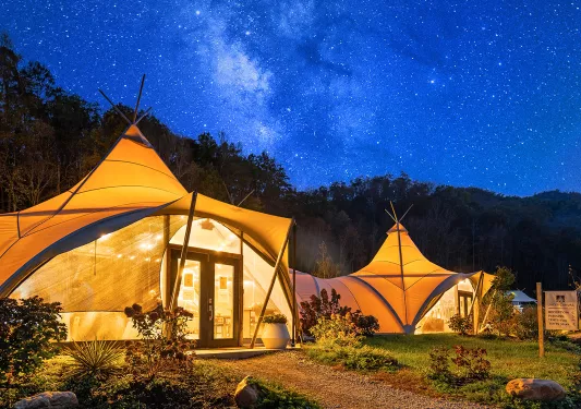 Shot of the Under Canvas camping village during nighttime. 