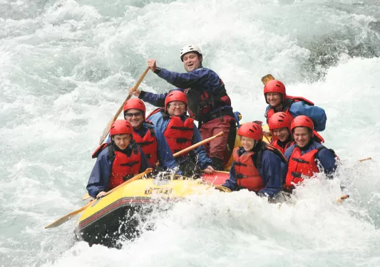 Rafting through white water rapids in New Zealand