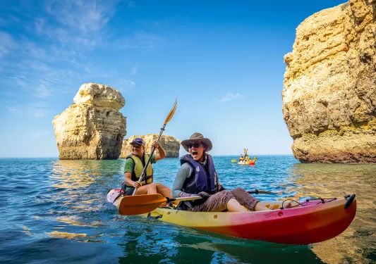 Kayaking among towering rocks in Portugal