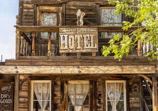 Storefront shot of the "MANE STREET HOTEL", old west style building.
