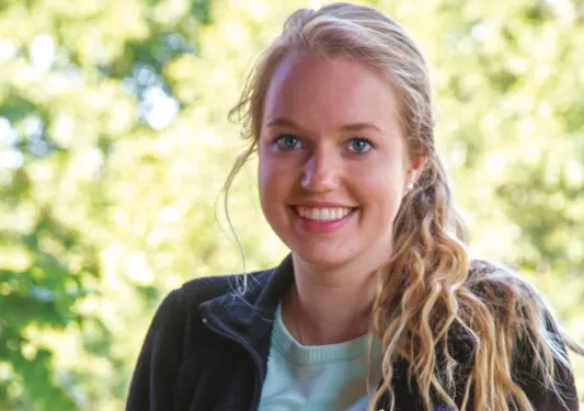 Woman holding plate of food