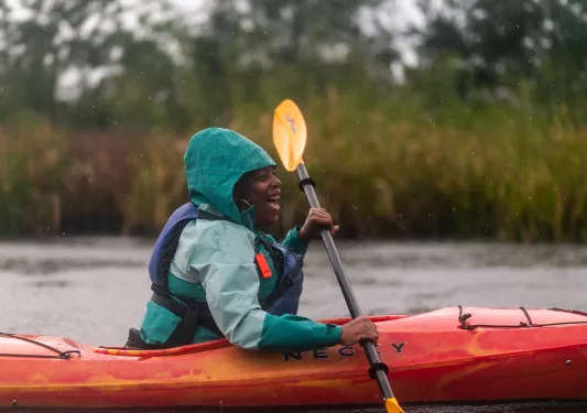 Guest kayaking in rain.