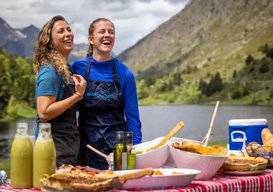 Two leaders with a prepared Backroads picnic