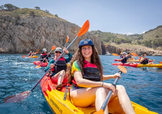 Group of happy young kayakers