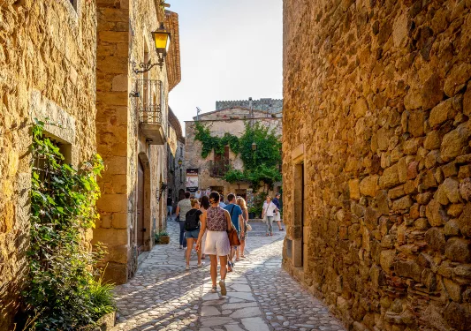 Walking down a cobblestone street in Europe