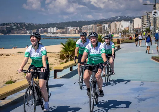 Backroads bikers riding along a beach