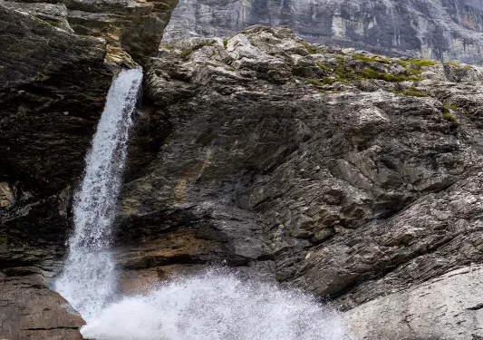 Wide shot of craggy waterfall.