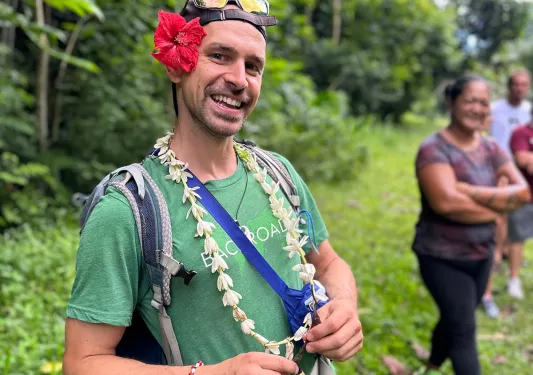 Backroads leader in Tahiti with a flower behind his ear