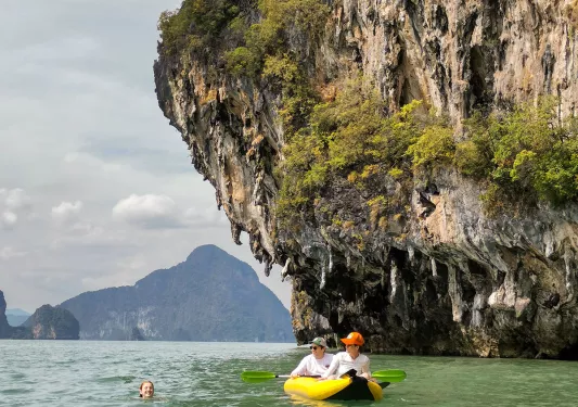 Kayaking in Thailand among large rock formations