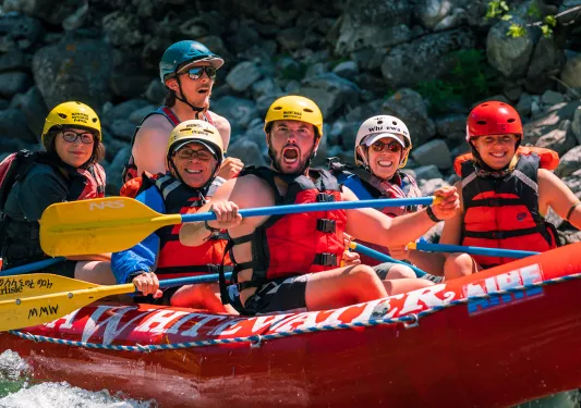 Backroads guests posing for a pic while white water rafting