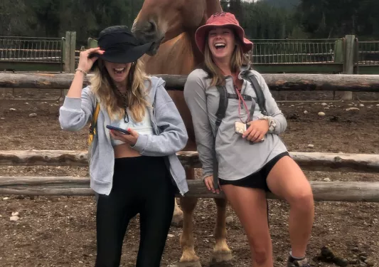 Backroads guests posing with a horse