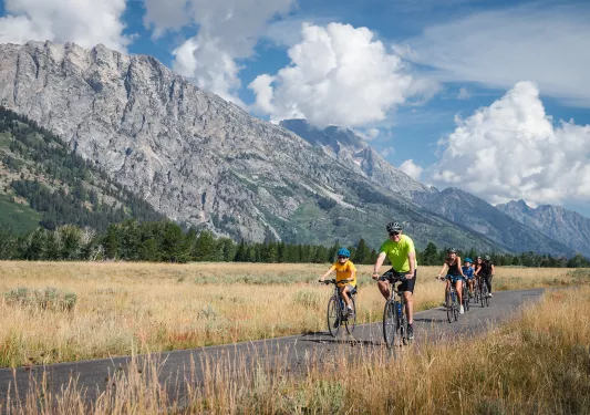 Backroads family smiling while biking 
