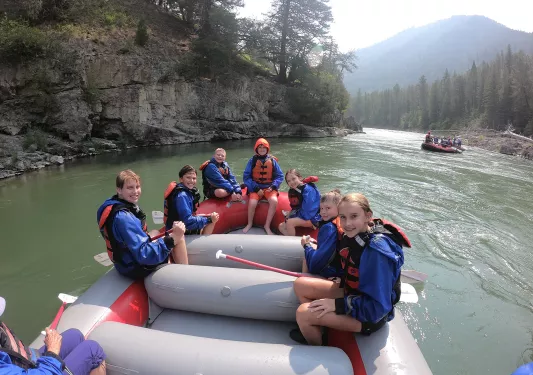Backroads guests smiling on raft 