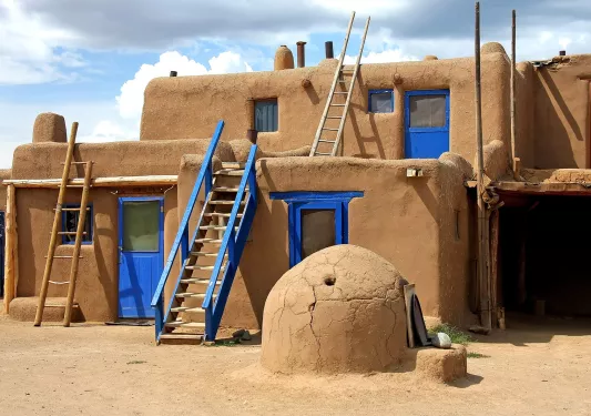 Orange clay structure with blue doors