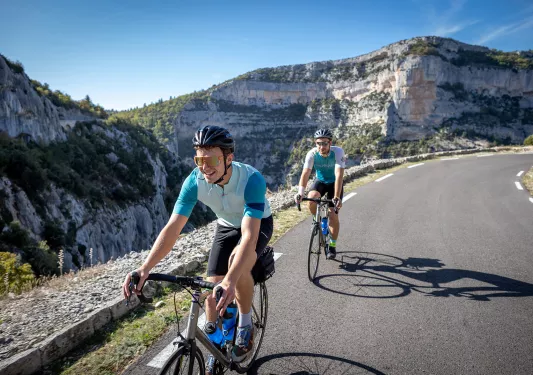 Bikers riding along a mountain road in France