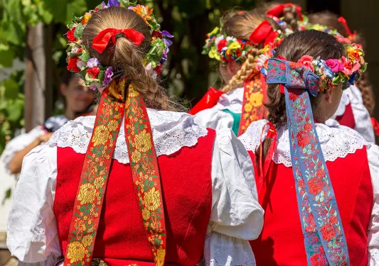Women with German braids and ribbons in hair.