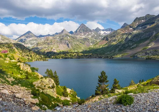 Wide shot of Respomuso Reservoir, mountains all around.