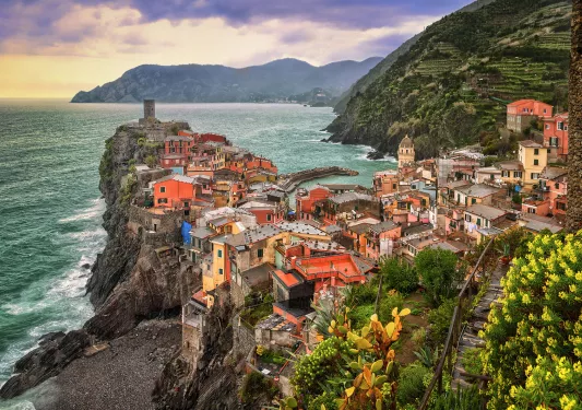 Wide shot of Cinque Terre coastal village.