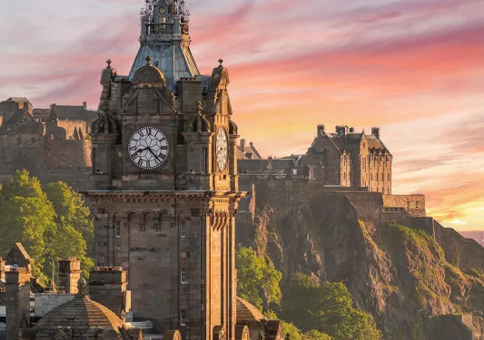 clocktower against a pink sunset