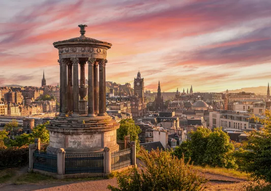 Monument overlooking the city during sunset