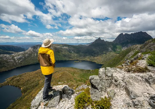 Hiker explores landscape of Marions lookout trail in Cradle Mountain National Park in Tasmania, Australia. 