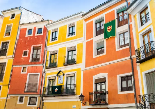 Red, orange, yellow housefronts.