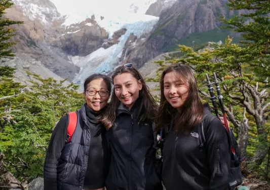 Three hikers posing while in Patagonia.