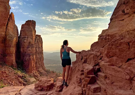 Guest on red-rock clifftop, overlooking Utah valley.