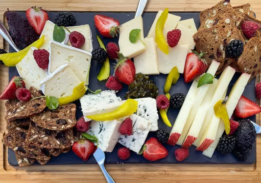 Charcuterie spread, cheese, fruits, crackers, etc.