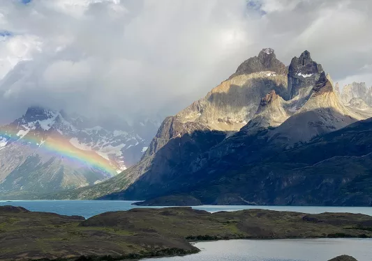 Shot of river, lake, mountains, clouds, ranbow.