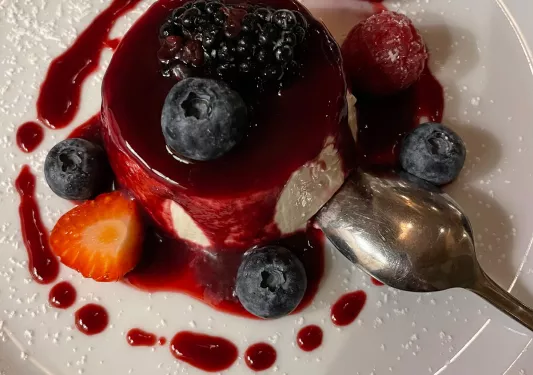 Close-up of berry panna cotta.