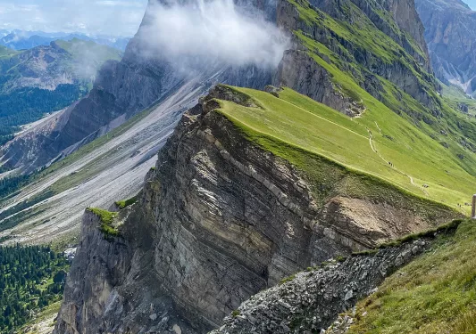 Wide shot of sharp-peaked mountain range.