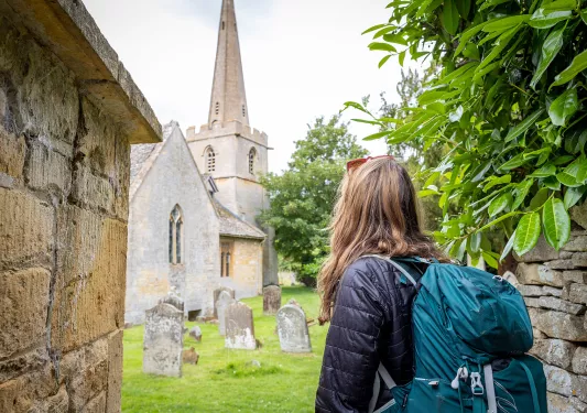 Backroads guest visiting English graveyard.