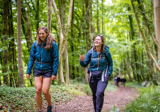 Two women hiking on trail in England.