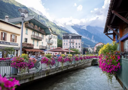 Shot of the Chamonix River, surrounded by storefronts.