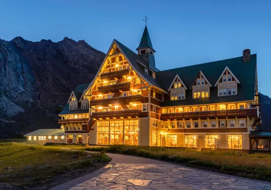 Lit up cabin in rocky mountians