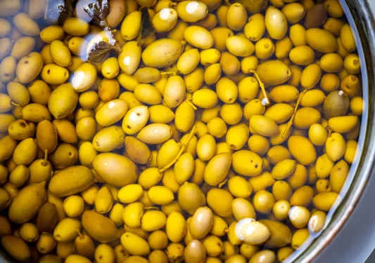 Close-up of olives in oil.