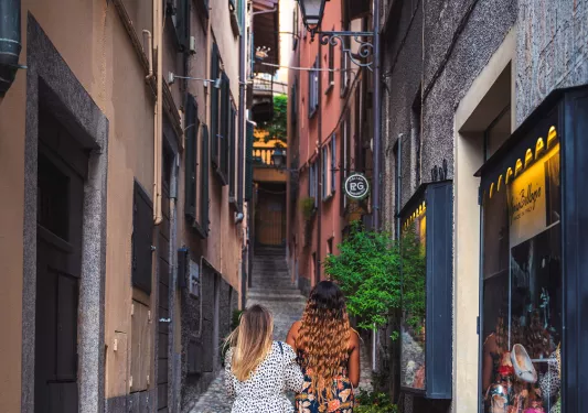 Two guests walking down narrow alleyway.