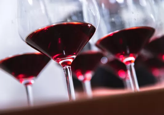 Close-up of red wine filled glasses.