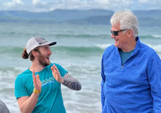 Guests Talking in Front of Sea Ireland